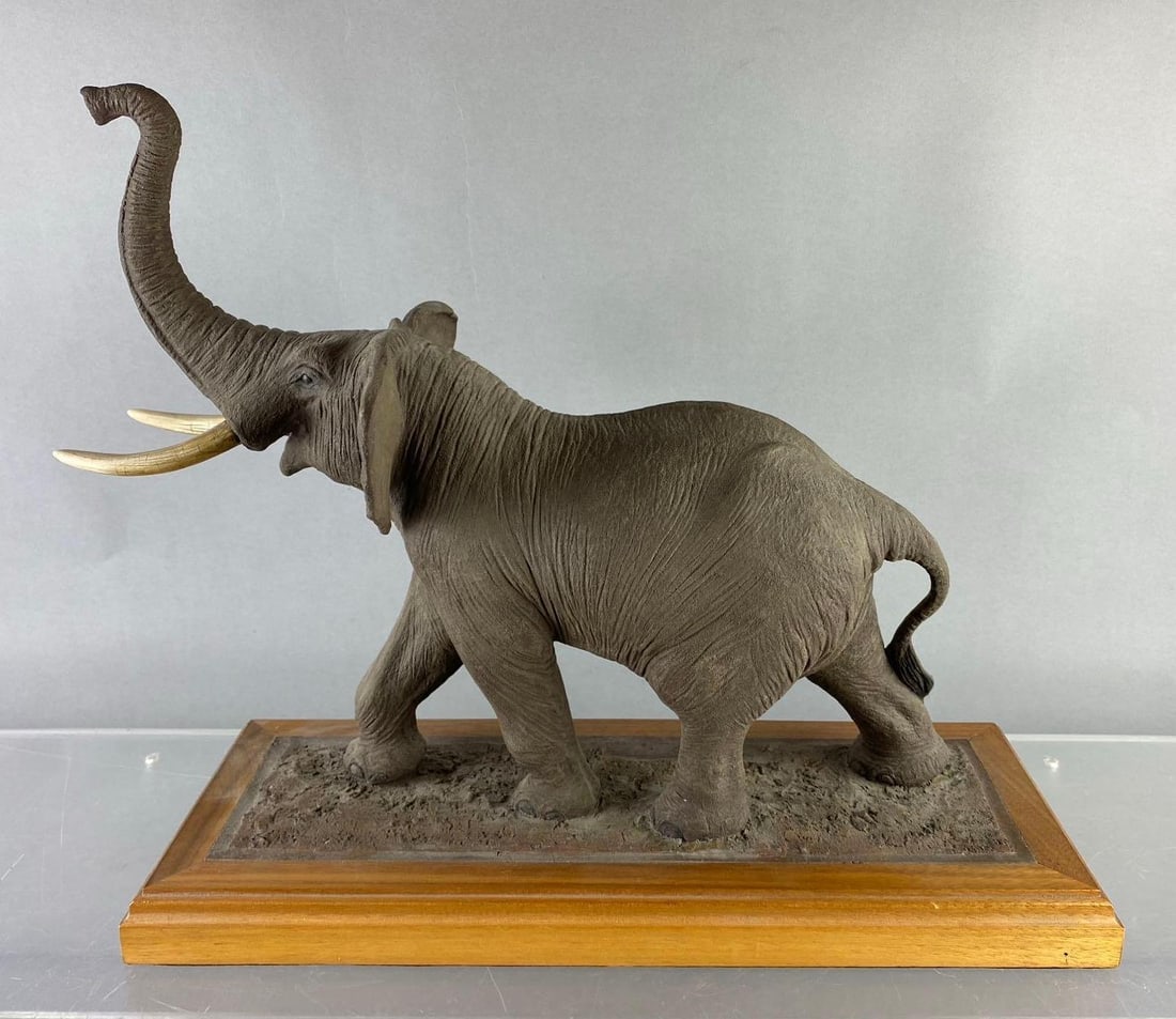 Louis Paul Jones Studios Elephant Sculpture Figure: Tusk needs to be glued back on. Measures H 14 x W 6 x L 14 1/2