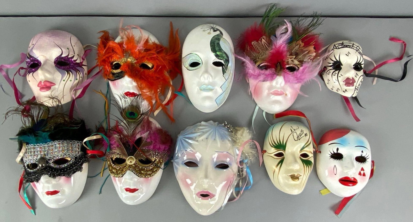 Group of Porcelain Miniature Masquerade Masks: Some repaired cracks and chips, Largest measures 8? H x 6? W x 3 1/2? D