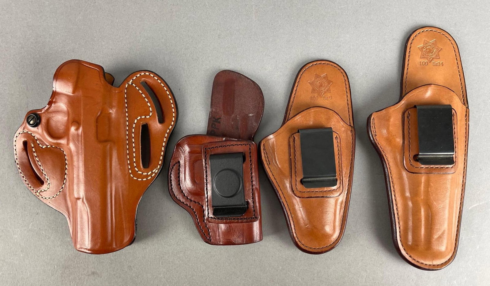 Group of Leather Firearm Holsters: Tallest measures 9 1/2"