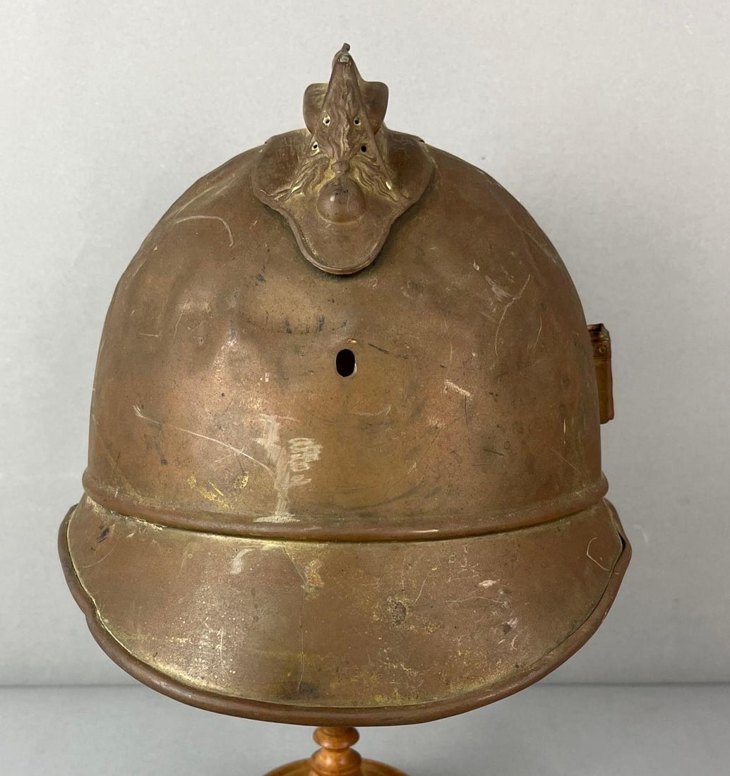 Antique French Fireman Helmet: Does have some dents. Measures H 8 x W 8 X D 10 inches.