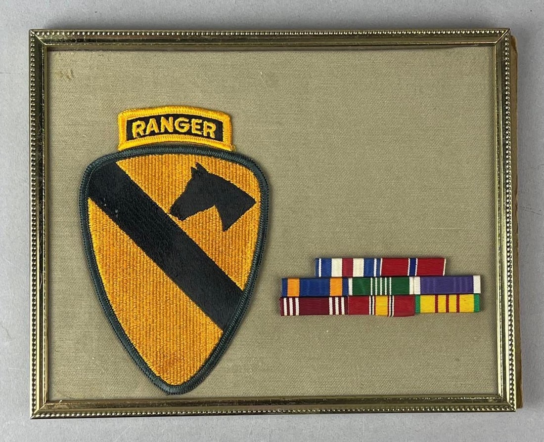 US Army 1st Cavalry Patch and Ribbons: Includes Purple Heart, Silver Star, Bronze Star ribbons and more. Frame measures H 8 1/4 x W 10 1/4 inches.