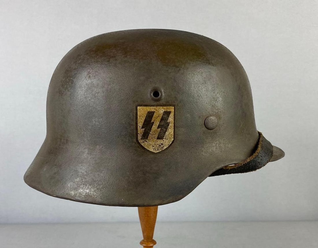 Reproduction German Style Single Decal Waffen SS M42 Helmet: Marked ET64 and 407 on inside measures H 6 x W 9 x L 11 inches. Stand not included.