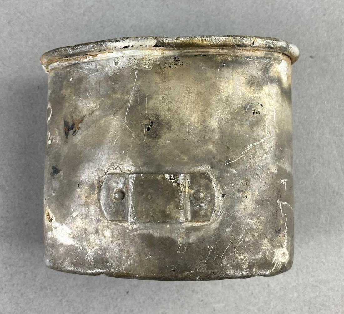 WW2 German Waffen SS Canteen Cup: Battlefield recovered. Has small pinholes and some original paint left. Marked 196/35 SS RZM on back. Measures 3” in length.