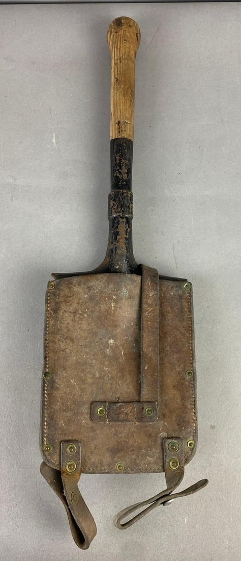 WW2 1940 Swiss Army Shovel with Cover: Shovel is dated 1940 and cover is marked Sattler St. Gallen, Switzerland 1915. Measures 21” in length. Cover has mold.