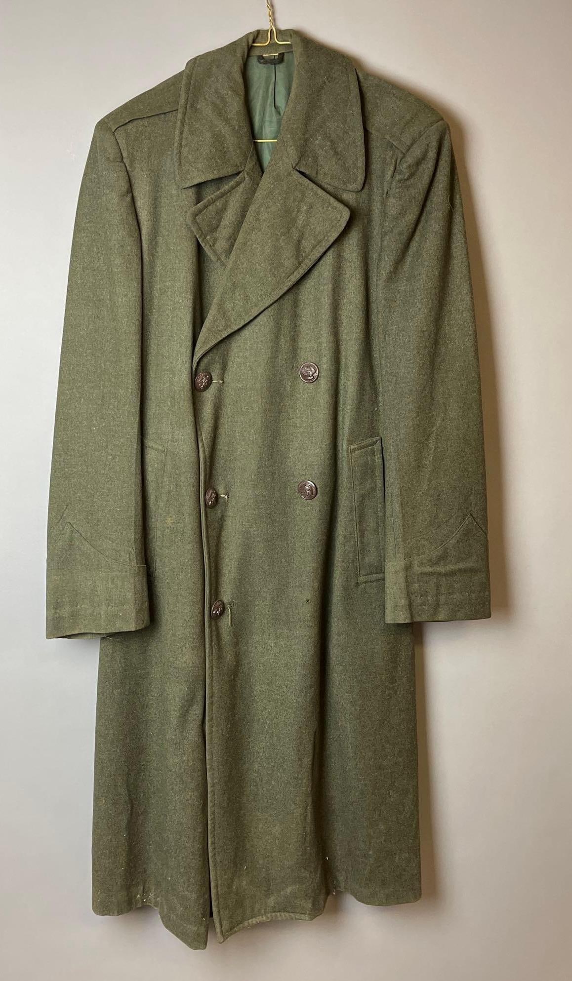 WW2 Marine Trench Overcoat: Does have a tear and a missing button.