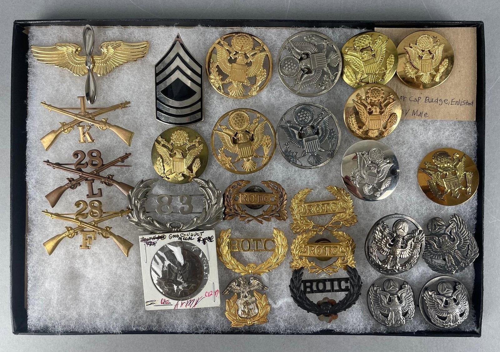 Group of U.S. Military Insignia: Includes army good conduct, WW2 era, cap badges