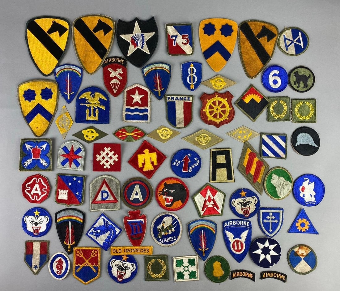 Group of Assorted WW2 US Army Military Insignias Patches: Includes Meritorious Service patch, old Ironsides, and more. Largest measures 3”