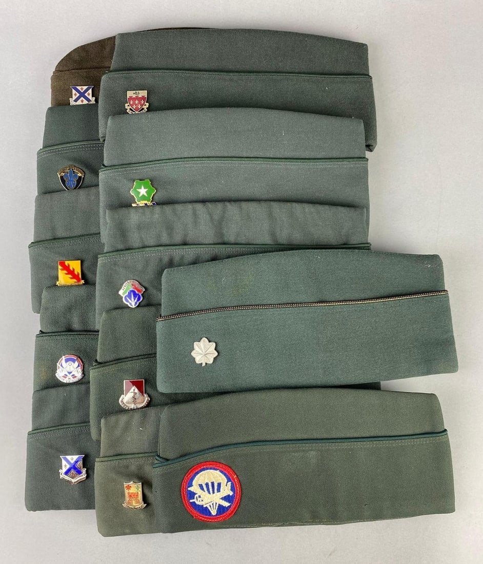 Group of 12 US Garrison Caps with Pins: Includes Victory and Death, Down to earth, and more. One cap measures 10” in length.