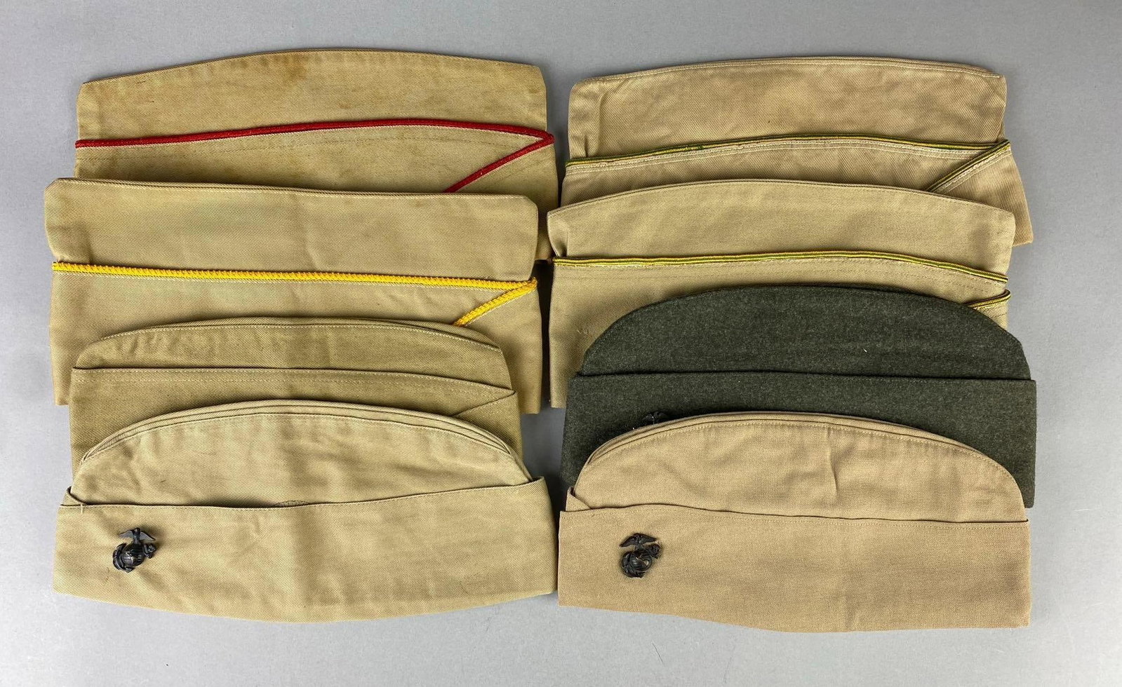 Group of Assorted US Marines Garrison Caps with Pins: Largest measures 10” in length.