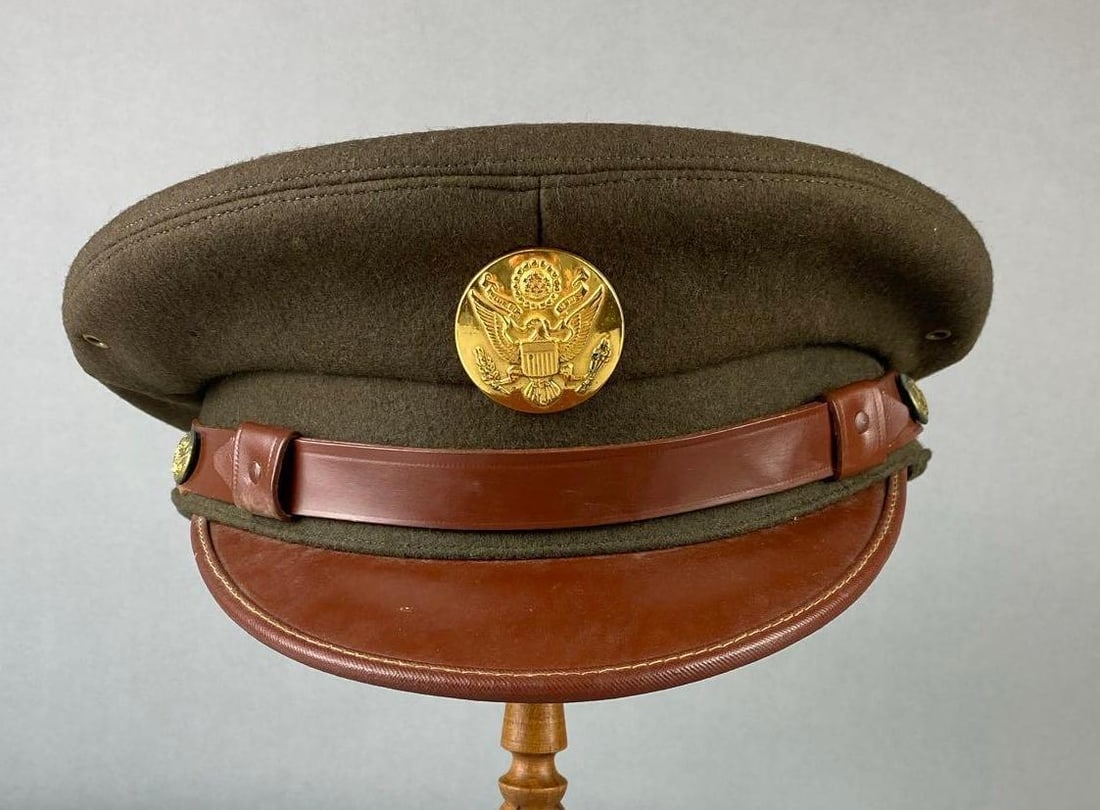 WW2 US Army Enlisted Visor Cap: Mfg by Wimbledon. Measures 7 1/8” stand not included.