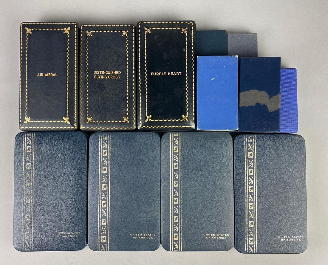 Group of Assorted Empty US Military Medal Presentation Cases: Includes Purple Heart, Flying Cross, and more. Larg measures L 7 x W 4 inches.