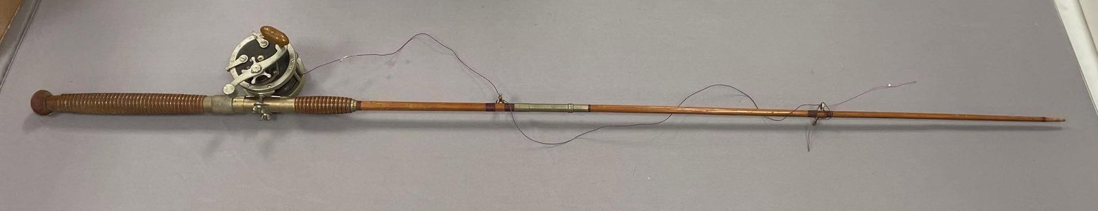 Vintage Bamboo Fishing Pole with Penn No. 49 Deep Sea Reel: Pole missing tip, measures 66"