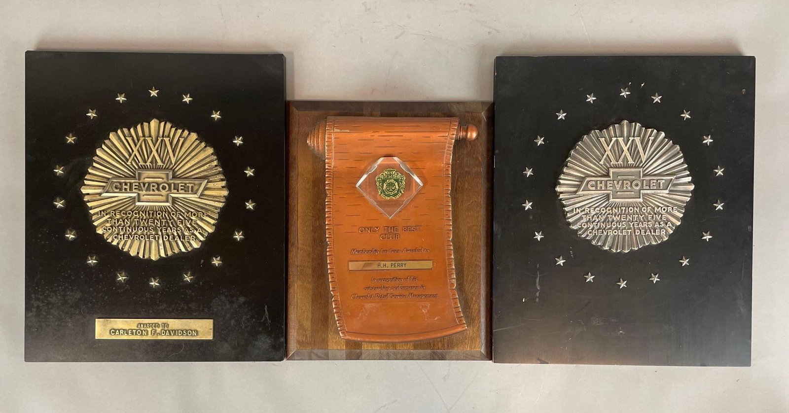 Group of Chevrolet Dealer Service Wall Plaques: 1 25 year plaque missing bottom edge, measures 17 1/2" x 14 1/2"