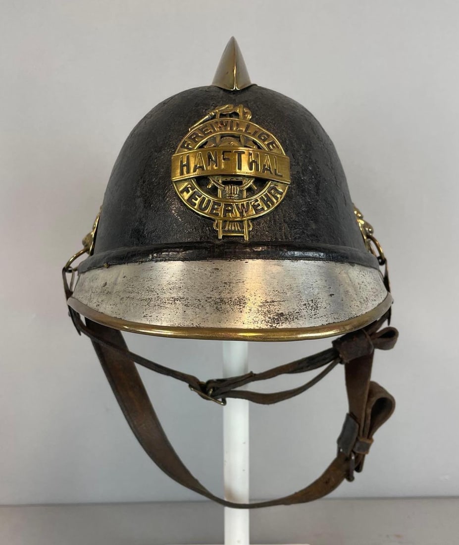 Antique German Hamthal Volunteer Fire Brigade Helmet: Turn of the century, leather liner and straps, stand not included, measures 6 3/4" x 7 3/4" x 10 1/2"