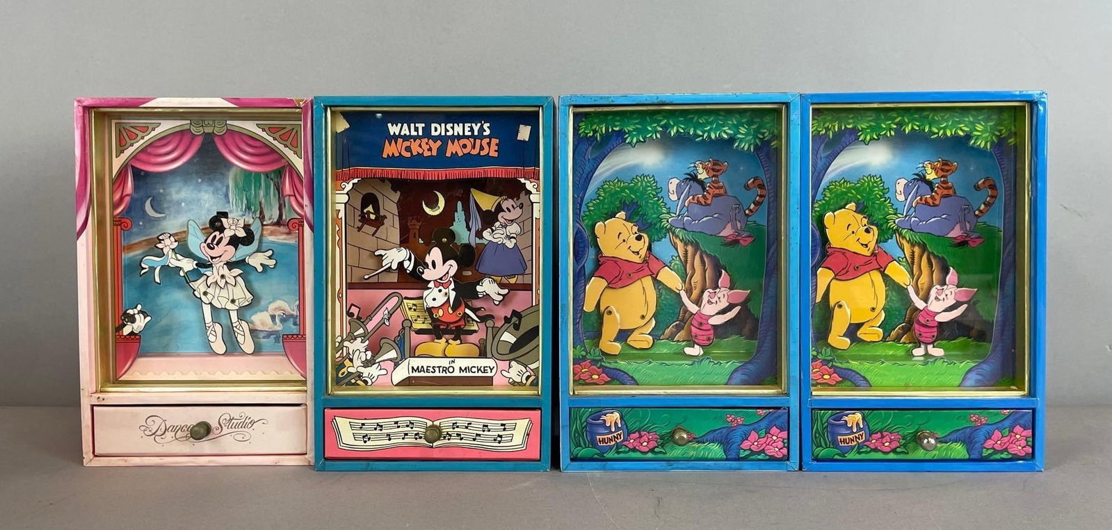 Group of Disney Wind-Up Music Motion Jewelry Boxes: Working condition, Mickey, Minnie, Winnie the Pooh, each measure 8 1/4" x 5 1/4" x 3"