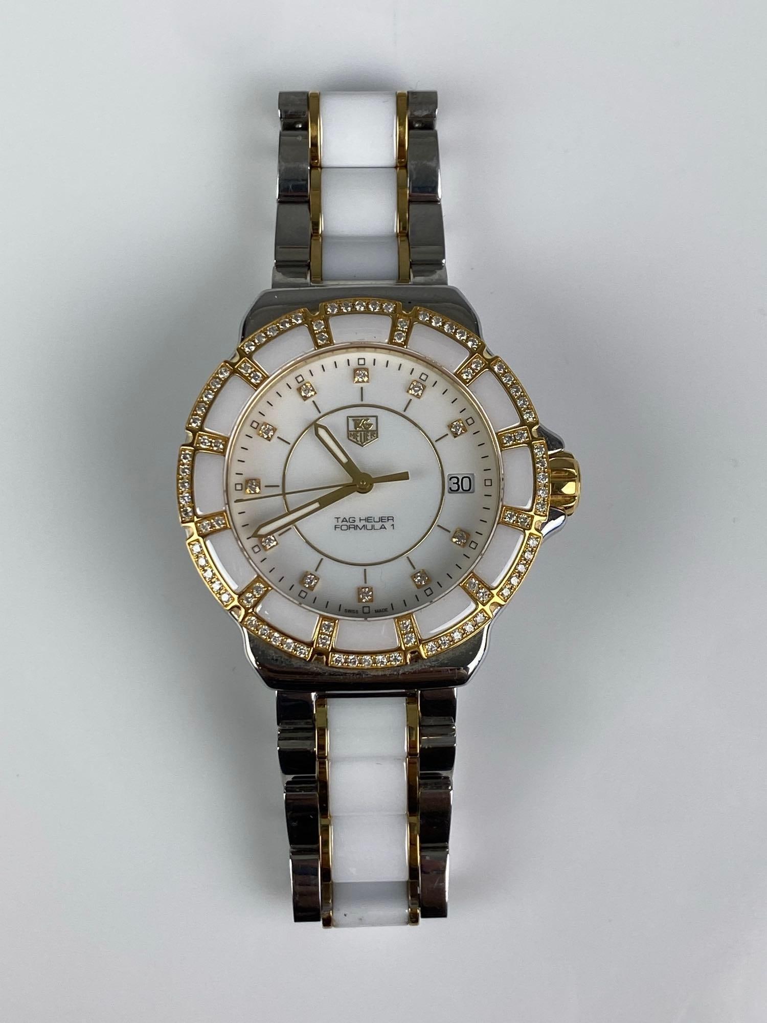 Tag Heuer Formula 1 18K Yellow Gold Plated Diamond Wristwatch: In working condition, includes additional links, sapphire Crystal, inner circumference measures 6