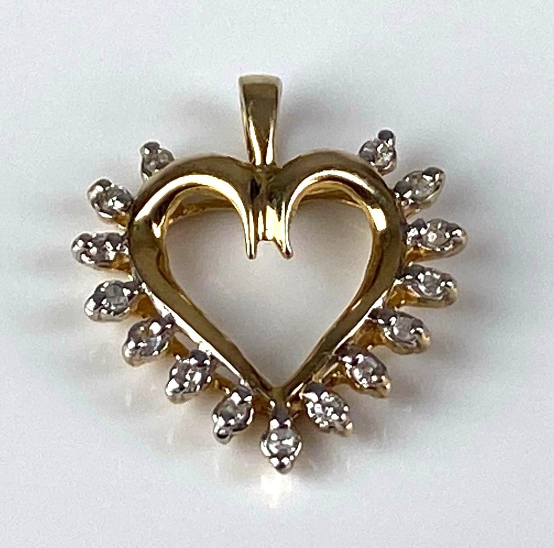 ADL Signed 10K Yellow Gold Diamond Heart Pendant: Total weight of 1.1 grams, measures 3/4? H x 1/2? W