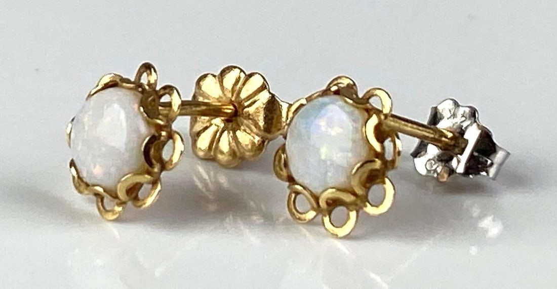 Pair of 14/10K Yellow Gold Fire Opal Stud Earrings: Total weight of 0.8 grams, earrings are 10K, backings Om each are 14K, one includes non original 14K White gold backing, each measures 1/2? In Length