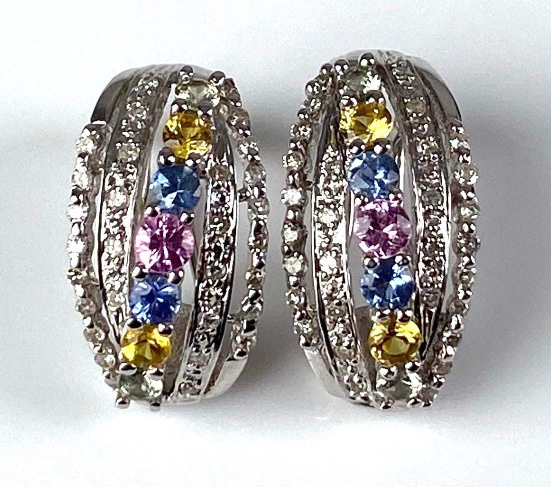 Pair of Signed 14K White Gold Multi-Gem Earrings: Total weight of 6.1 grams, each measures 3/4? H, features Diamond, Sapphire, Ruby, topaz and Peridot