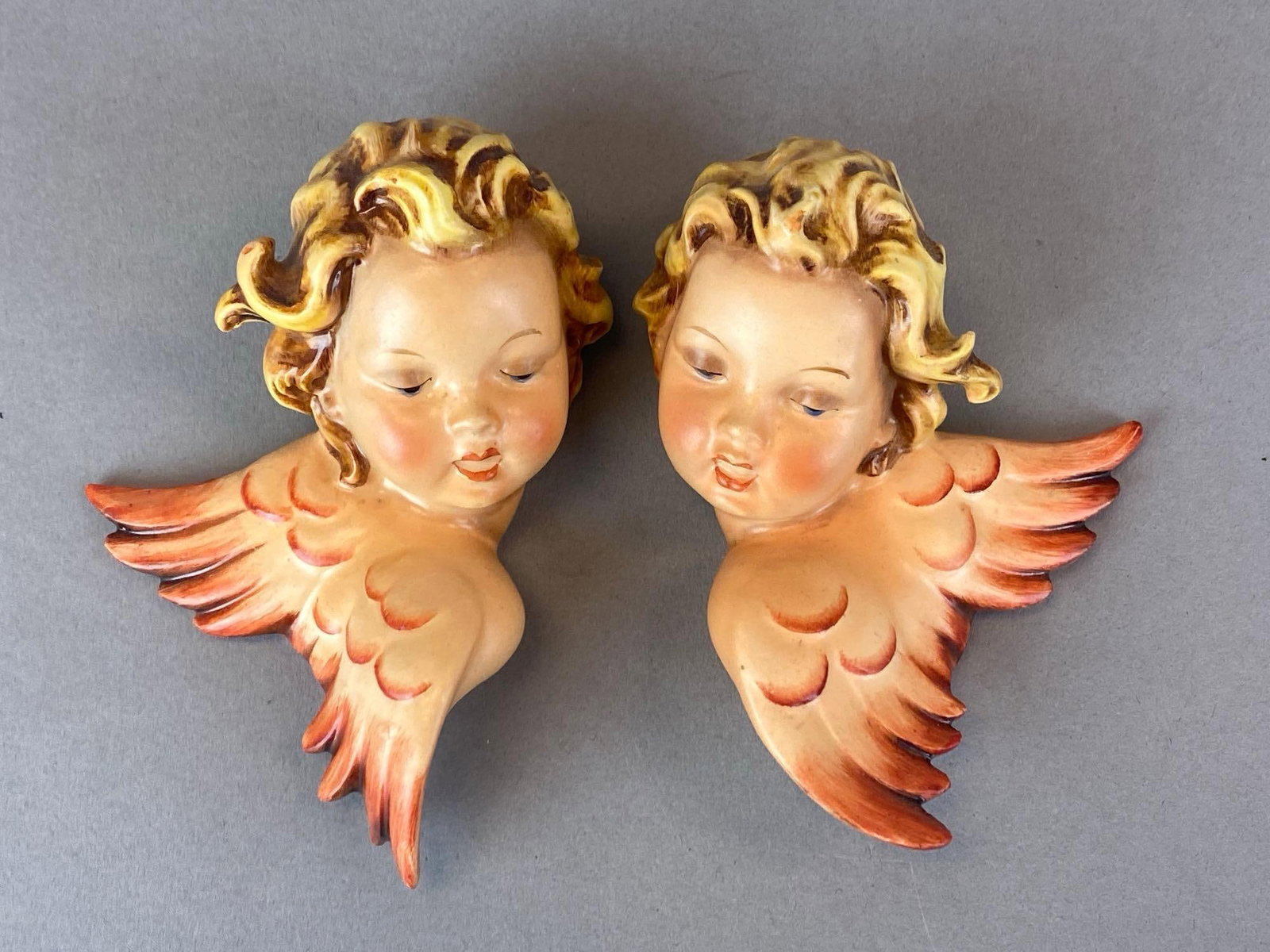 Pair of 1957 W. Goebel Sacrart Porcelain Cherub Wall Plaques: Made in west Germany, Each marked on back, largest measures 5? H x 3 1/2? W x 1 1/2? D