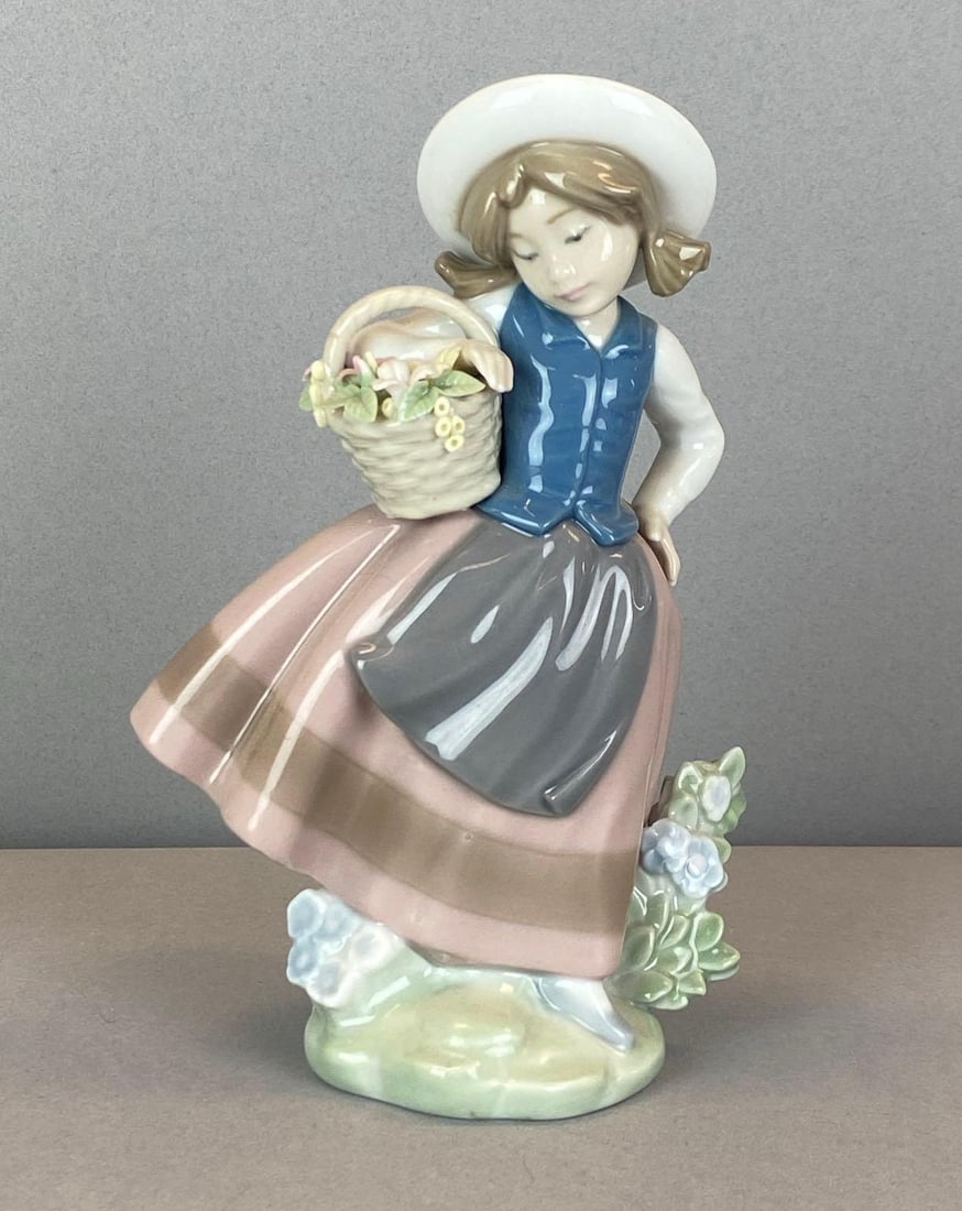 Lladro Sweet Scent Porcelain Figurine: Marked on base, one chipped flower in flower basket, measures 6 1/2? H x 4? W x 3 1/2? D