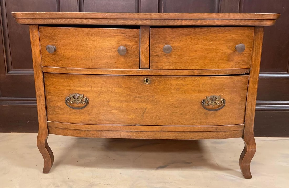 Antique Bow Front Chest of Drawers: No in-house shipping available, 3rd party shipper recommended. Repaired front leg, measures 25 3/4" x 38" x 19 1/2"