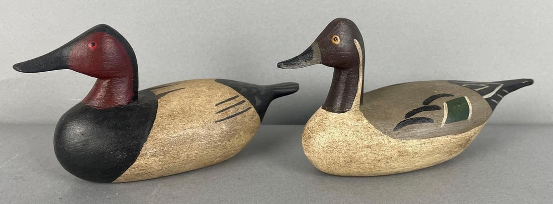 Group of 2 Miniature Drake Duck Decoys: Includes canvasback, pintail with repaired beak, both stamped BC, largest measures 3 1/4" x 6 3/4" x 2 1/4"