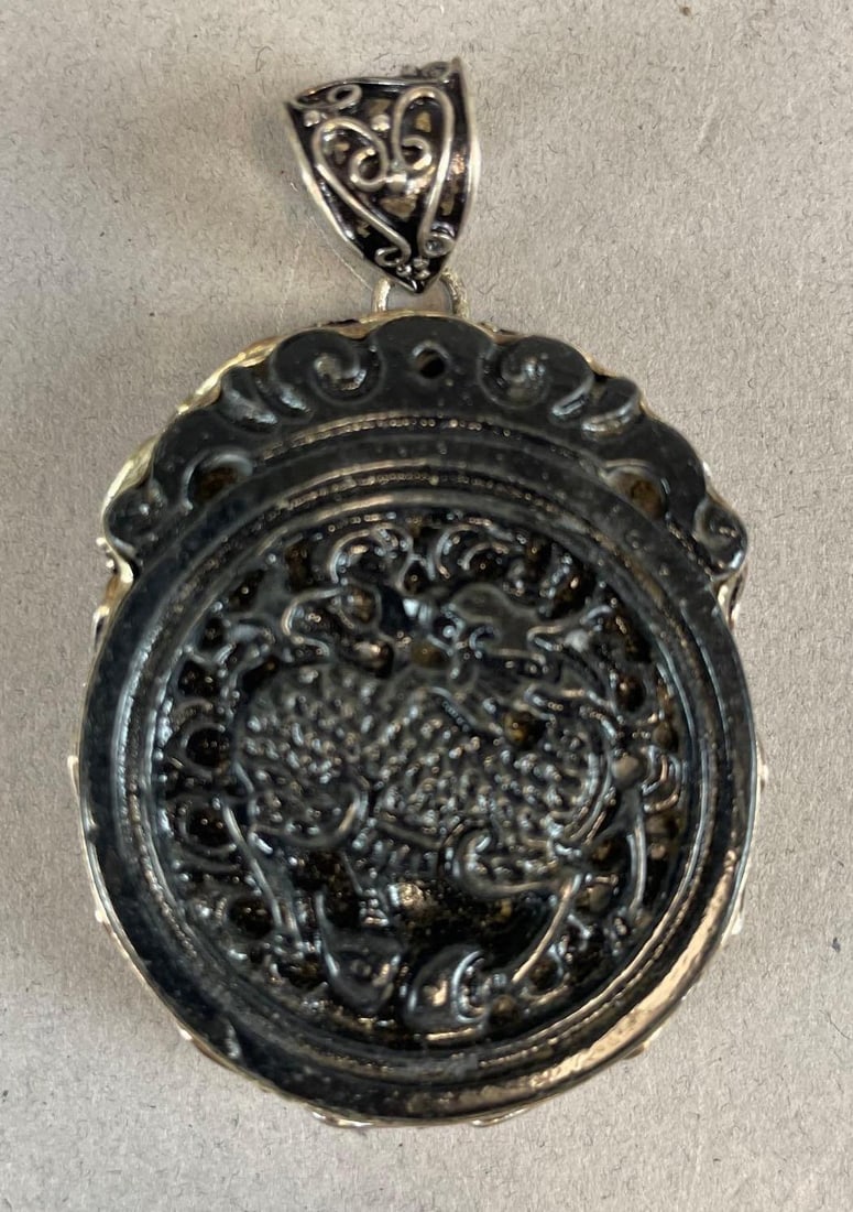 Sterling Silver and Obsidian Carved Animal Pendant: Possibly a deer or horse, stamped 925, measures 2 1/2" x 1 3/4"