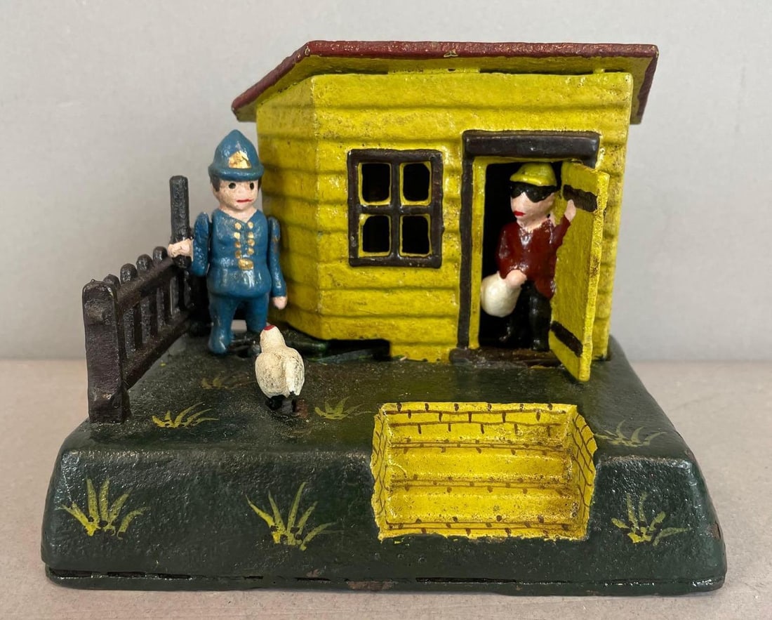 Book of Knowledge Reproduction Mechanical Cast Iron Uncle Remus Bank: Working condition, measures 4 1/4" x 5 1/2" x 3 1/2"