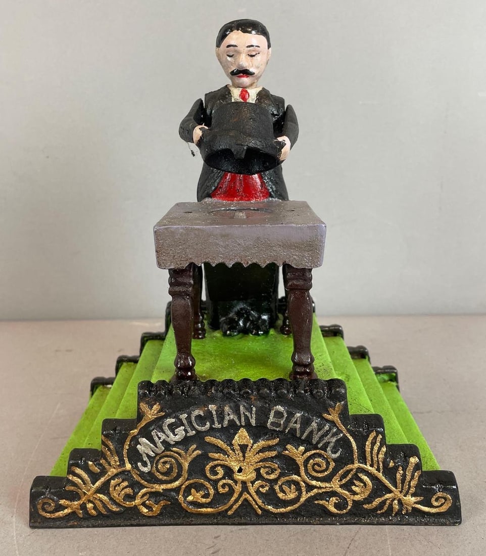 Book of Knowledge Reproduction Mechanical Magician Cast Iron Bank: Working condition, measures 80 x 6 1/2" x 4"