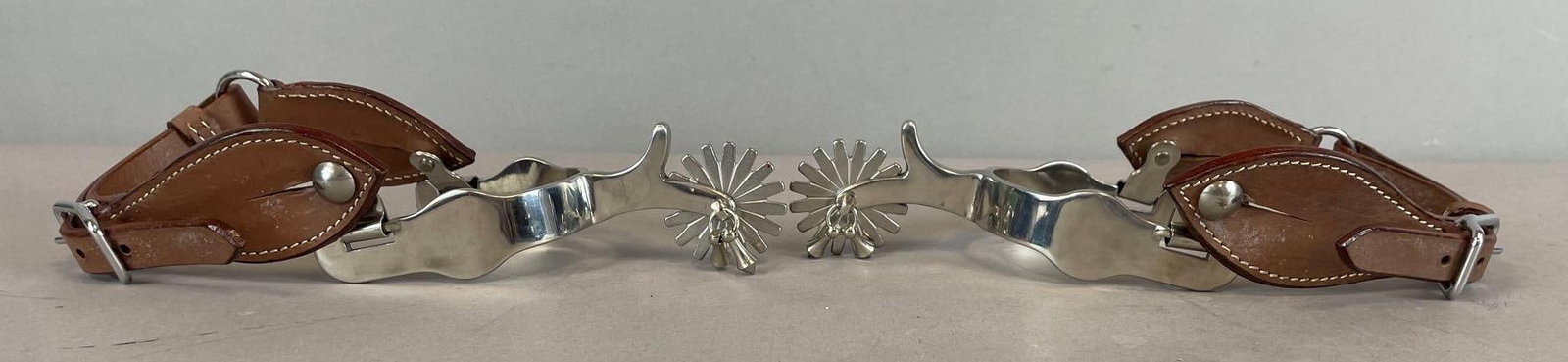 Pair of Stainless Steel Cowboy Boot Spurs: 16 point with leather straps
