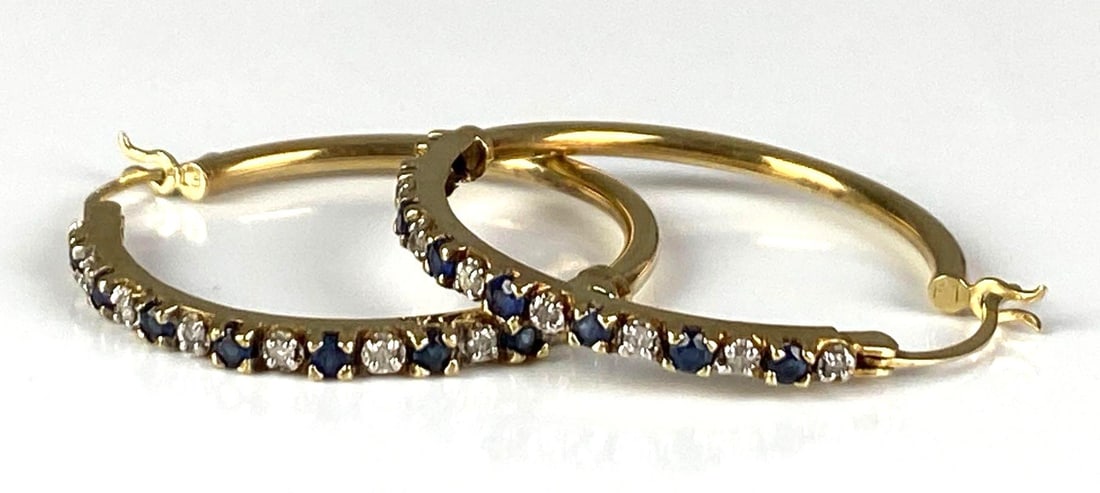 Pair of 10K Yellow Gold Diamond Purple Topaz Hoop Earrings: Total weight of 3.3 grams, each measures 1? H x 1 1/4? W