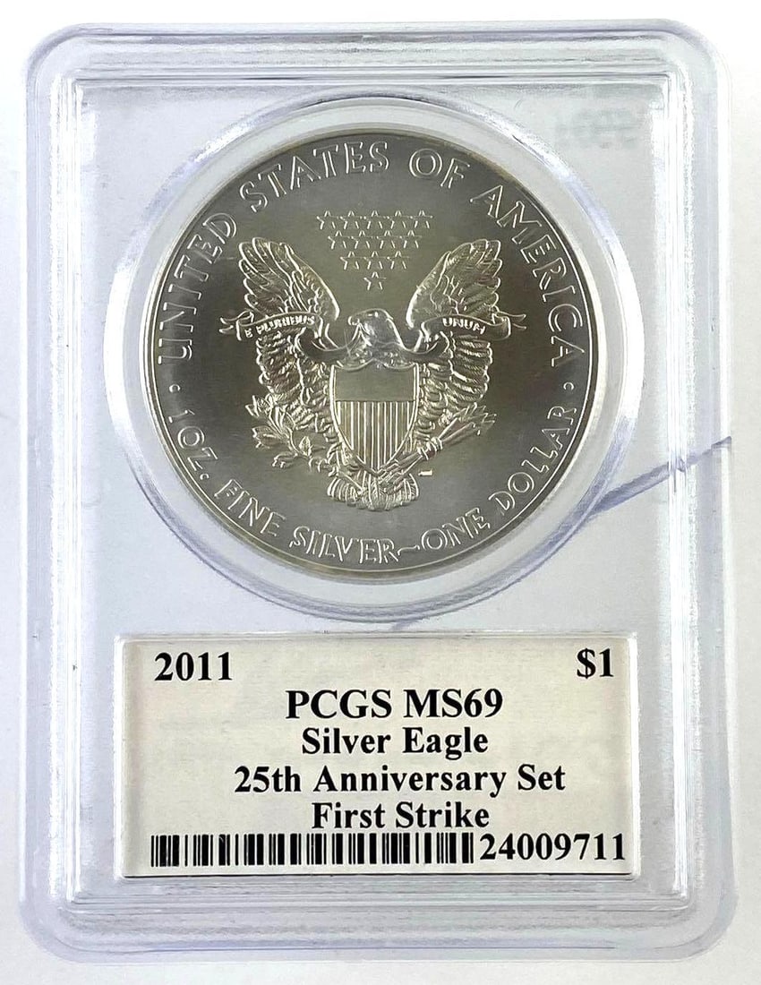 2011 US 1 oz .999 Fine Silver American Eagle PCGS Graded MS69: 25 AnniversaryFirst StrikeJohn M. Mercanti 12th Chief Engraver of U.S. Mint SignedHas crack in slab