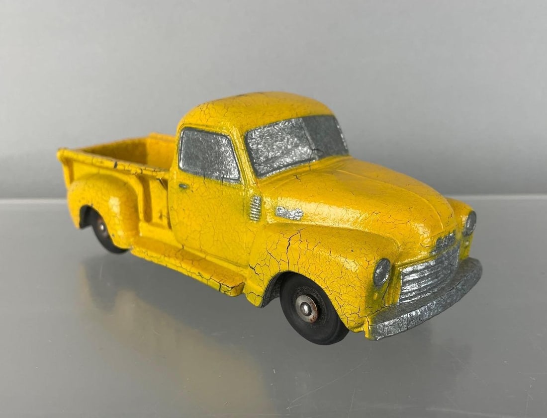 National Products 1950 GMC Dealership Promo Truck: Cracked yellow paint, chassis has crack, wheels don't roll
