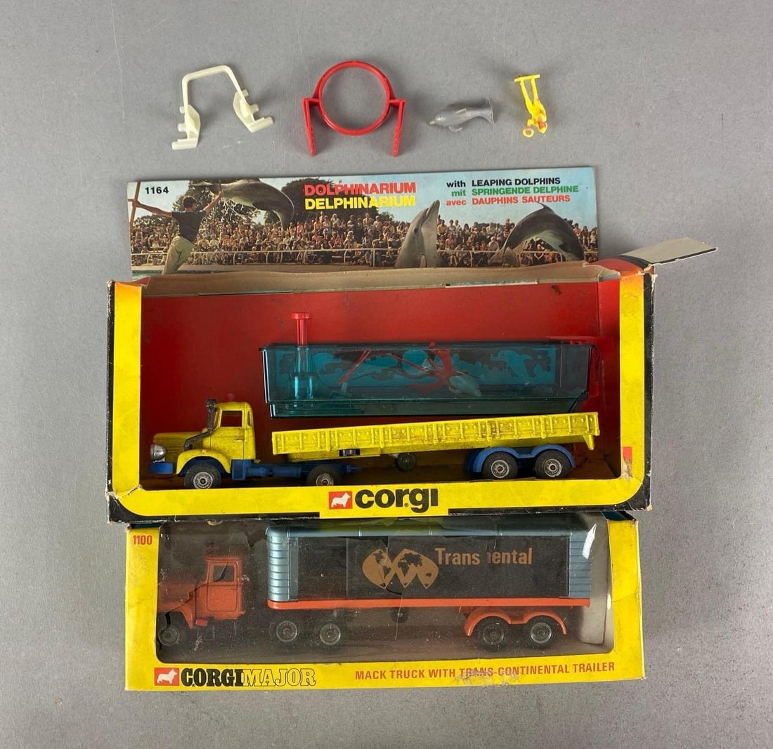 Group of 2 Corgi Die-Cast Truck Haulers: Boxes are in rough shape, Inclufed Mack truck with transcontinental trailer and dolphinarium
