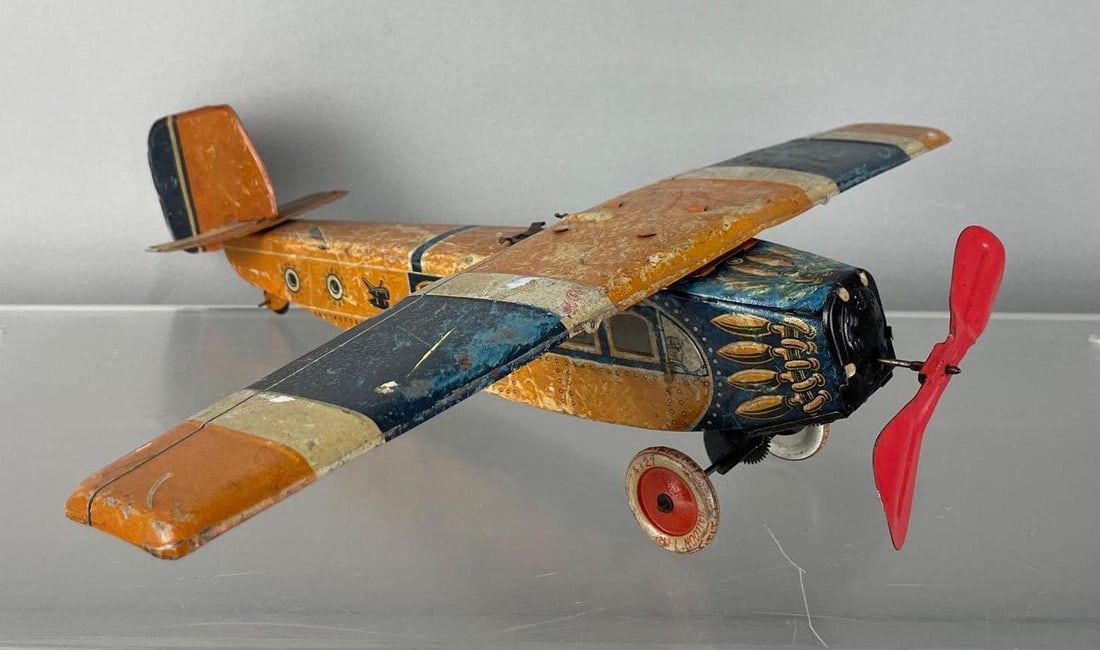 Vintage German Tin Litho Wind-Up Airplane: Working condition, measures 4" x 16 1/4" x 16 1/4"