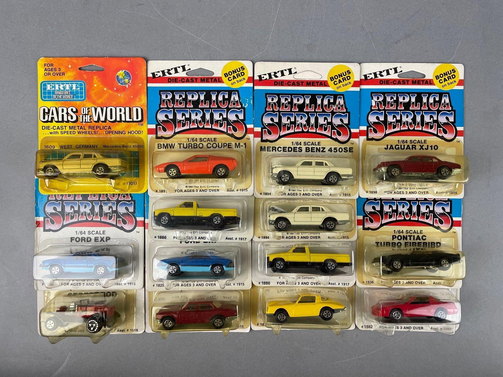 Group of Ertl Replica Series Die-Cast Vehicles: 1/64 scale, original packaging