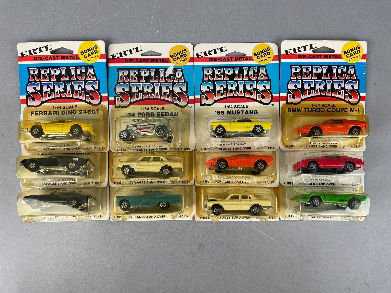 Group of Ertl Replica Series Die-Cast Vehicles: 1/64 scale original packaging
