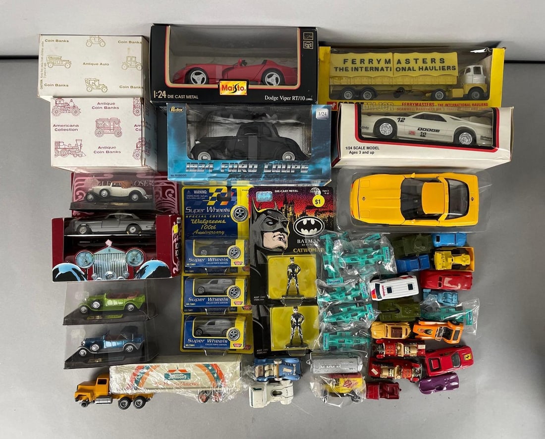 Group of Assorted Die-Cast Vehicles: Includes banks, Batman returns catwoman figures, 1:24 scale Maisto