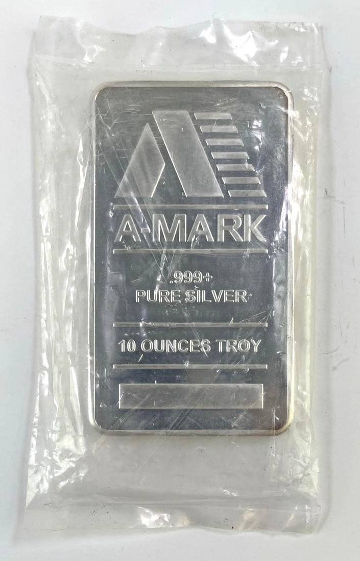 10 Troy Oz A-Mark .999+ Fine Silver Bar: A-Mark 10 troy ounce silver bar marked .999+ pure silver. Light surface wear from handling.