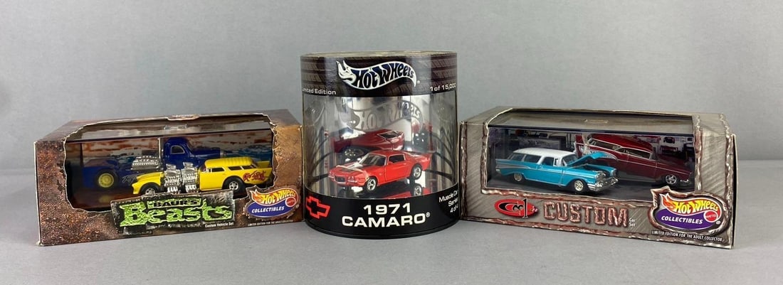 Group of 3 Mattel HotWheels 1:64 Scale Die Cast Vehicles: Includes Baurs beasts, cool n custom, and 1971 Camaro. H 2 1/2 x W 4 x L 6 1/2 inches. Like new in original packaging.