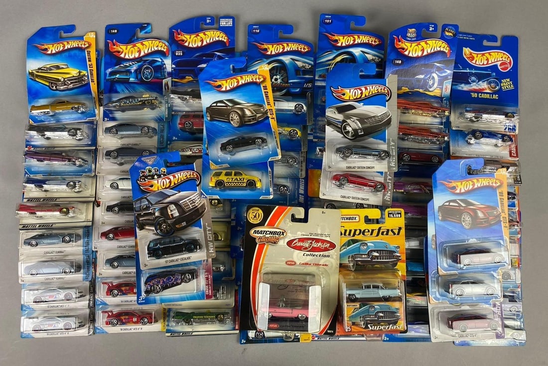 Group of Assorted Mattel HotWheels Cadillac 1:64 Scale Die Cast Vehicles and More: Like new in original packaging.