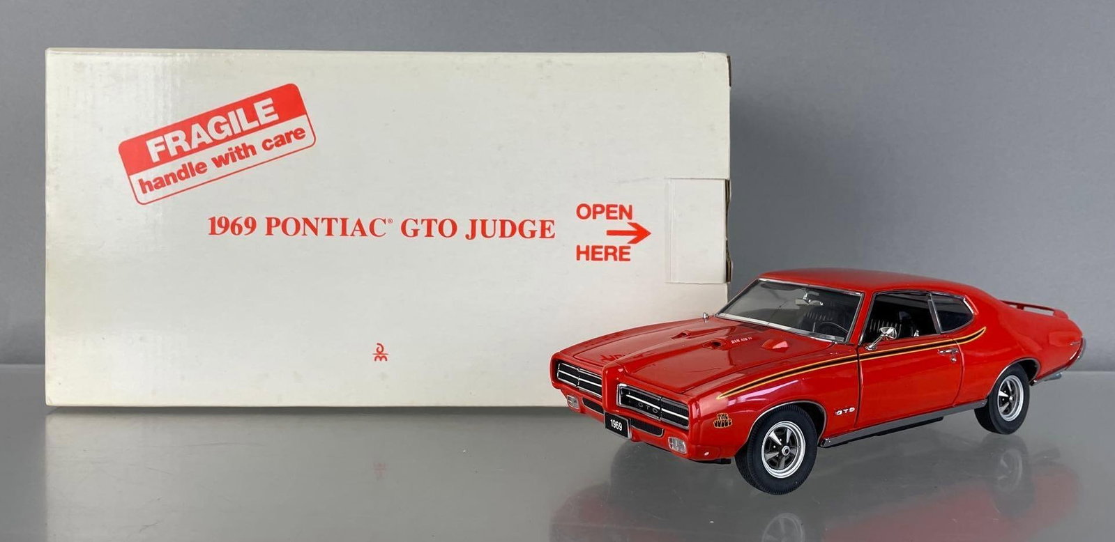 Danbury Mint 1969 Pontiac GTO The Judge Die-Cast Car: 1/24 scale, orange, antenna broken, original packaging