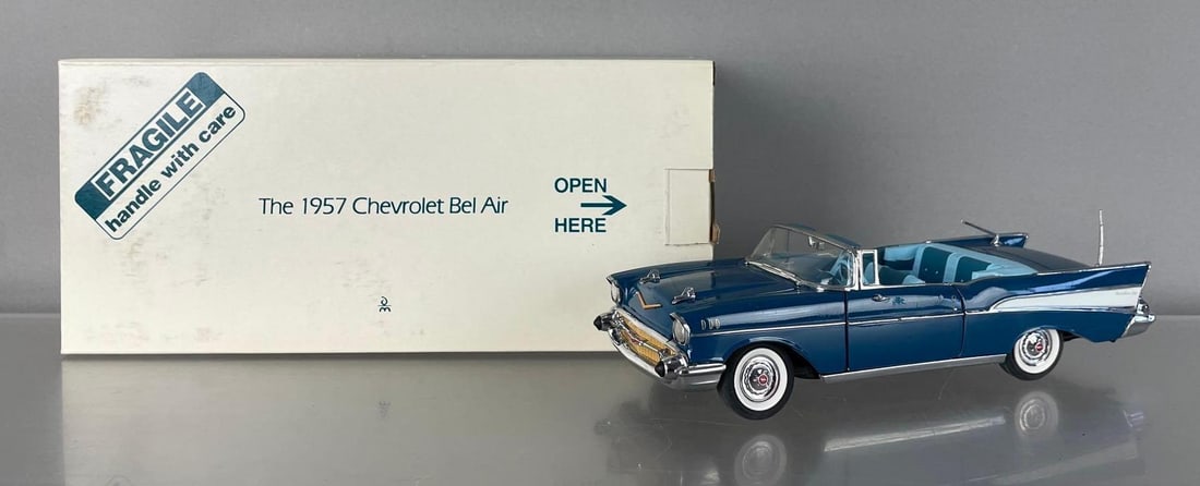 Danbury Mint 1957 Chevy Bel Air Convertible Die-Cast Car: 1/24 scale, blue, damaged driver door, bent antenna, original packaging