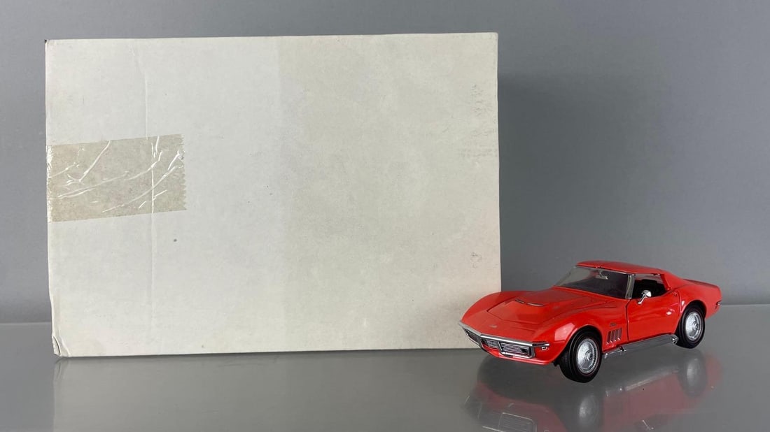 Franklin Mint 1969 Chevy Corvette Die-Cast Car: 1/24 scale, orange, t tops, original packaging