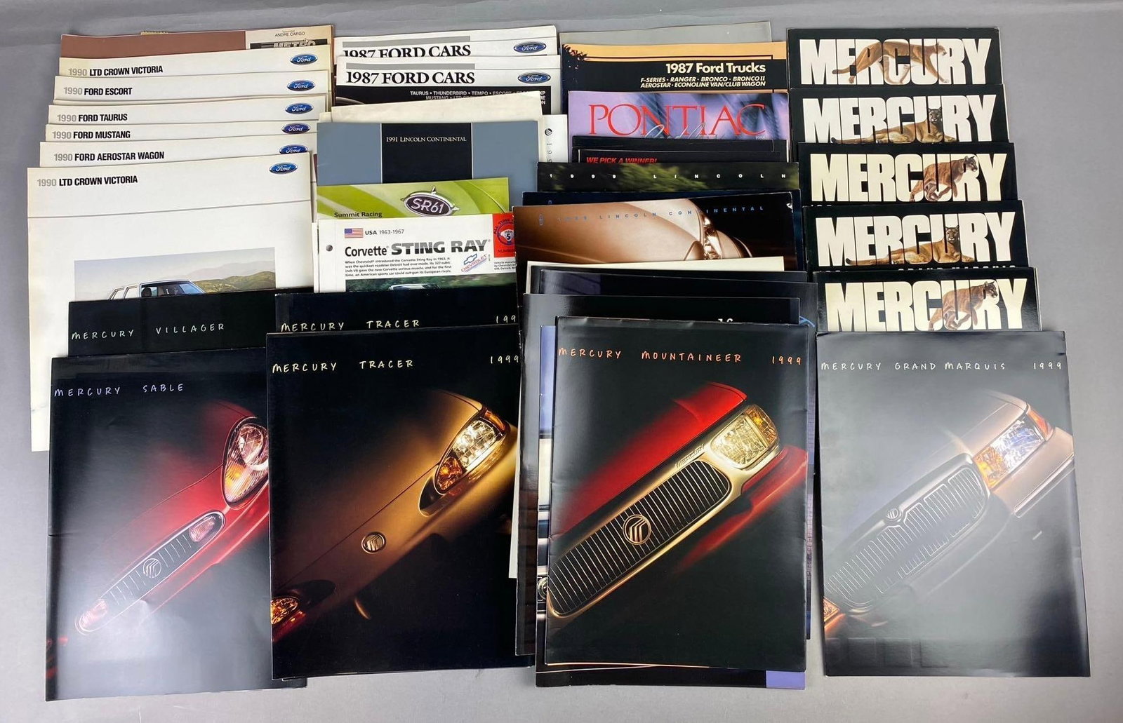Group of Assorted Vintage Ford/ Mercury Automotive Brochures and More: Includes Mercury Series Brochure, Ford series, and more. Largest measures L 11x W 9 inches.