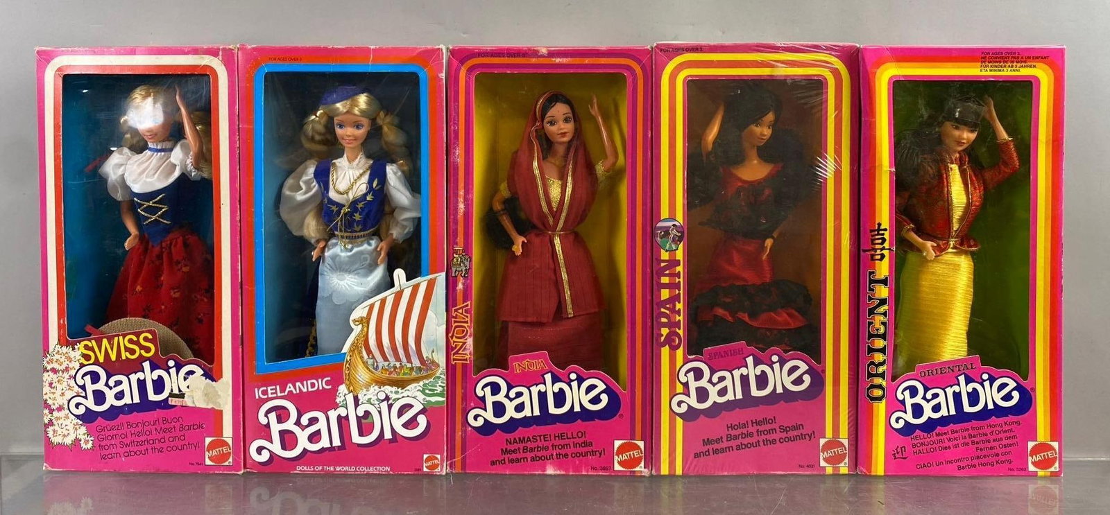Group of 5 Mattel World Barbie Fashion Dolls: Includes Swiss, India, and more. Mild wear throughout. New in packaging. Circa 80?s