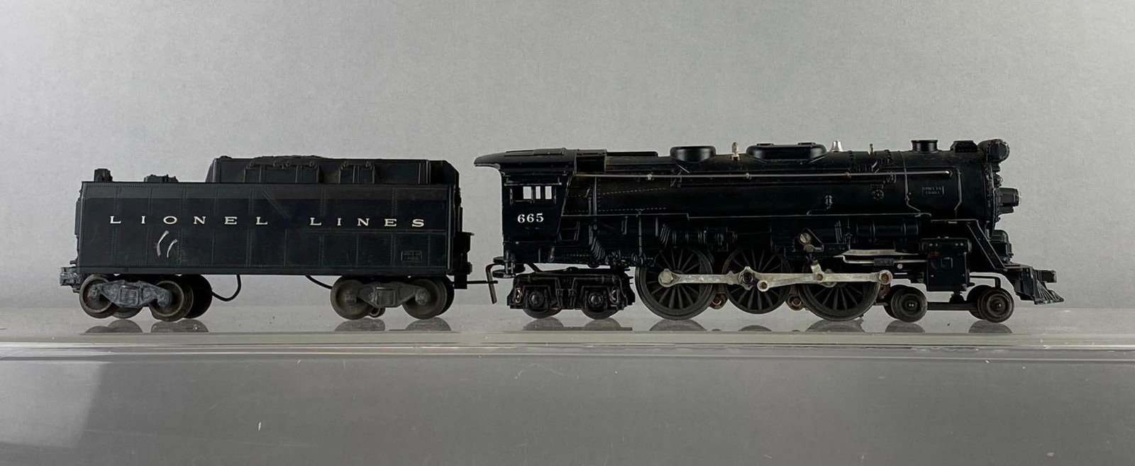 Lionel Trains O Gauge No. 665 Steam Locomotive and Tender: Untested. Locomotive measures H 3 x W 2 x L 11 inches.