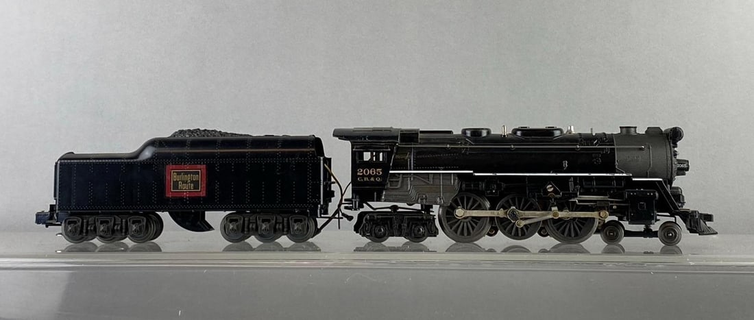 Lionel Trains O Gauge No. 2065 Steam Locomotive and Tender: Untested. Locomotive measures H 3 x W 2 x L 11 inches.