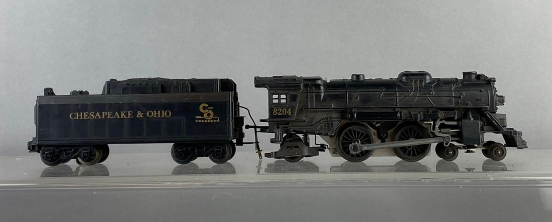 Lionel Trains O Gauge No. 8204 Steam Locomotive and Tender: Untested. Locomotive measures H 3 x W 2 x L 10 inches.